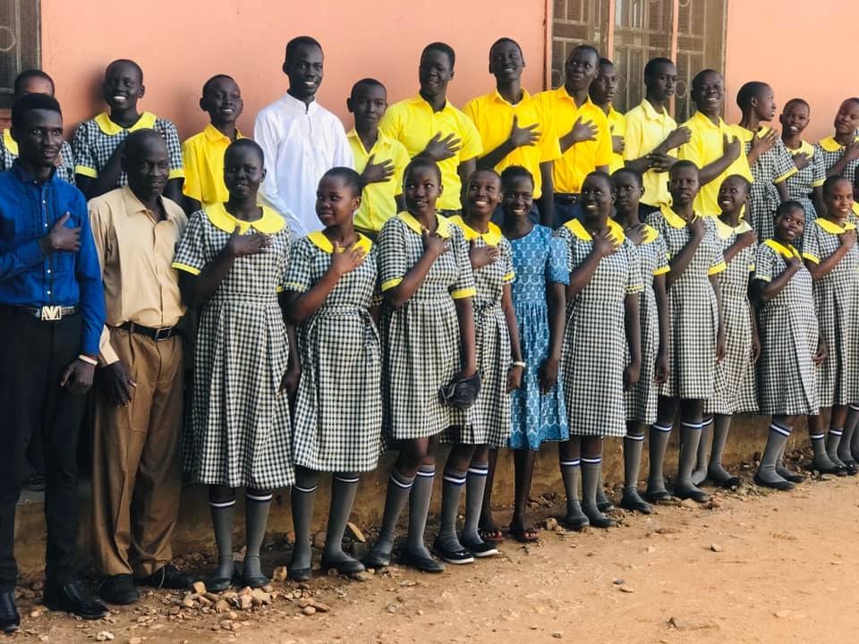 Students with hands on hearts